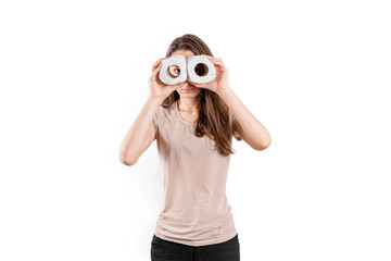 Young woman with toilet paper rolls on white isolated background. Toilet paper panic buying. Covid-19