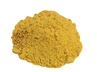 Seasoning mustard powder in a glass plate on a wooden background