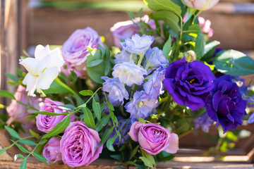 Decorative element from wooden boxes and fresh flowers. Details Party Decoration