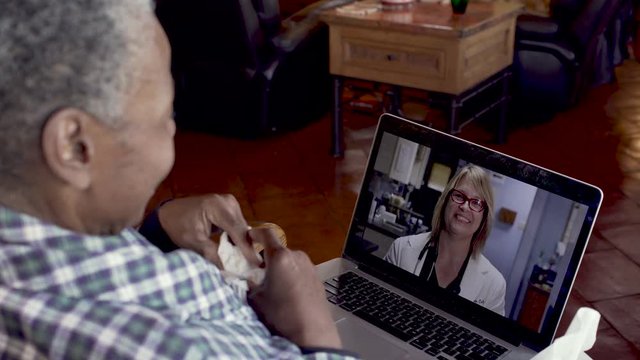 Old Black Woman Saying Goodbye To Her Doctor On A Video Chat Visit