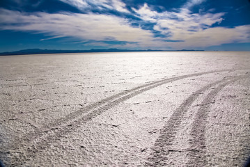 Landscape of Salar de Uyuni in Bolivia covered with water, salt flat desert and sky reflections