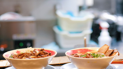 Close up and selective focus of Japanese food called Ramen in the kitchen , cooked ready for eat , traditional food in Japan.