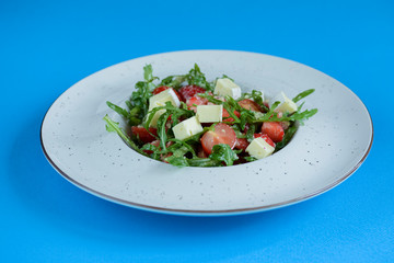 Greek salad with feta cheese, organic olives, juicy tomatoes, and lettuce. Concept for healthy nutrition.