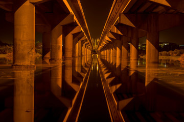 Twin bridge with night time reflections
