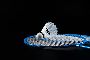 Badminton sport equipment on dark black background close up