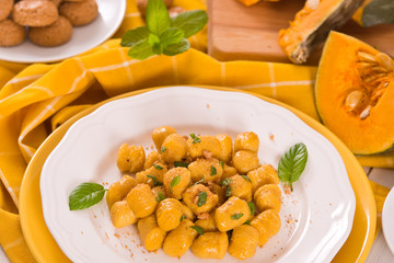 Pumpkin gnocchi with grated amaretti cookies.