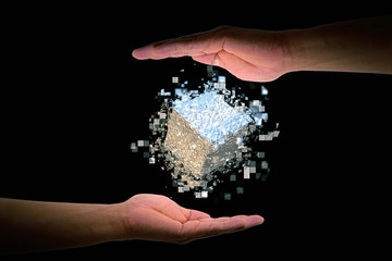 手のひらに浮かぶ抽象的な立方体