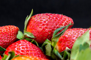  Fresh strawberries on a black background