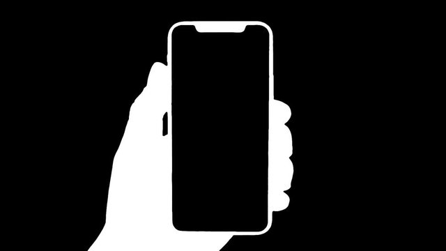 Man's hand holding a black smartphone with green screen and touching or press display, Man using mobile phone with chroma key zoom out display on green background.