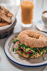 Breakfast tabl with bagel with coffee and juice