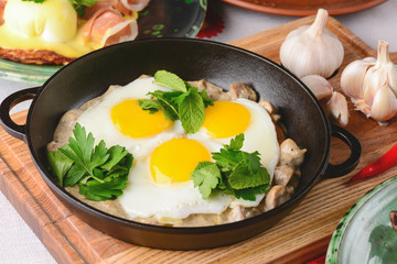 Fried egg with green spinach in pan, healthy breakfast. Healthy food.