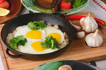 Fried egg with green spinach in pan, healthy breakfast. Healthy food.