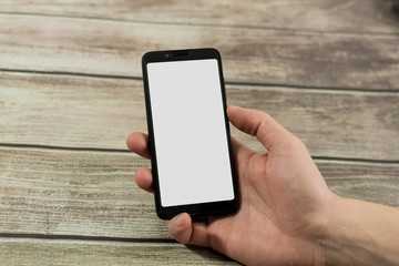 male hand with smart phone with white screen