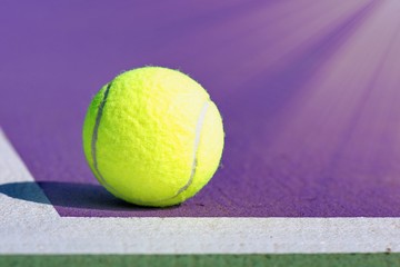 tennis ball on purple background