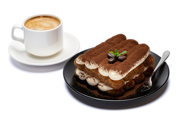 Classic tiramisu dessert on ceramic plate and cup of coffee isolated on white background with clipping path