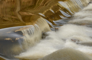 long exposure of cascade on a river