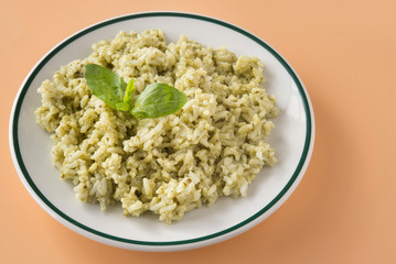 Traditional Mexican Arroz Verde green rice dish made of long-grain rice, spinach, cilantro and garlic