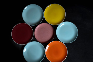 Multi-colored plates on a isolated black background.