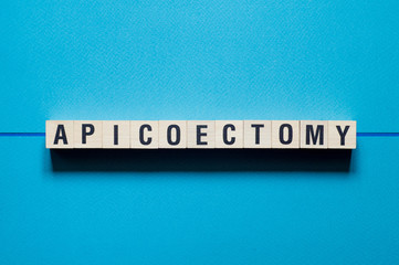 Apicoectomy word concept on cubes