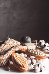 Natural brushes made of wood and soap on the background of concrete, bamboo toothbrushes PNOV2019