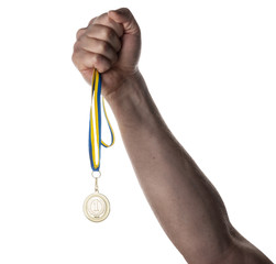 Fototapeta na wymiar Medal in hand on an isolated background