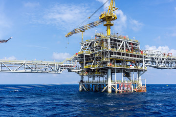 Offshore production platforms complex connected with bridges at oil field