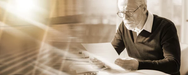 Foto op Plexiglas Senior businessman reading a document  multiple exposure © thodonal