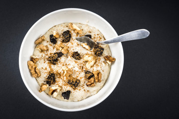 Oatmeal recipe with nuts, prunes, cinnamon and sugar, very healthy breakfast recipe
