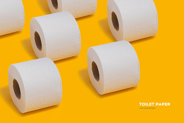 Toilet paper pattern on top on yellow background for banner or advertisement.
