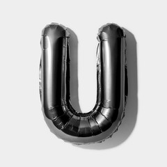 Letter U, Black foil balloon alphabet isolated on white background with Clipping Path