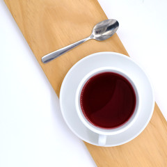 cup with tea and teapot on white  background, over light
