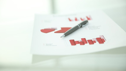 close up.financial chart and pen on light background