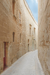 Fototapeta na wymiar Typical narrow street in former capital of Malta - Mdina