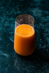 Healthy Organic Homemade Orange Carrot Citrus Mixed Fruit Juice in Glass.
