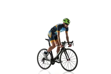  Triathlon male athlete cycle training isolated on white studio background. Caucasian fit triathlete practicing in cycling wearing sports equipment. Concept of healthy lifestyle, sport, action, motion. © master1305