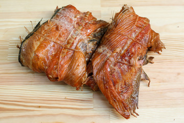 salted, smoked and dried fish, beer snacks, tasty fish on a wooden board