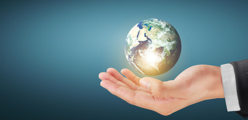Globe earth in human hand, holding our planet glowing. Earth image Furnished by Nasa