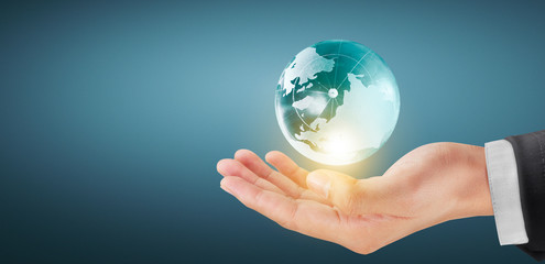 Globe earth in human hand, holding our planet glowing. Earth image Furnished by Nasa