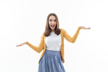 Portrait of a girl in a white t-shirt, yellow jacket and blue skirt on a white background. Portrait...