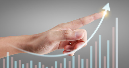Hand touching  graphs of financial indicator and accounting market economy analysis chart