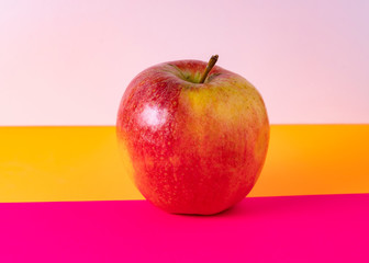red apple leftover fuchsia and orange colors background