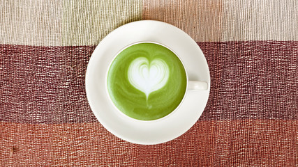 A cup of green tea matcha latte for background                                                                 