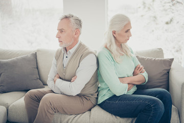 Side profile photo of two sad upset calm proud relatives dot not want to understand each other