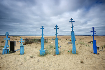 grave crosses in a desert cemetery / climate change concept warming, disaster, apocalypse,...