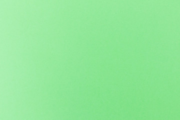 Details of a green paper background.