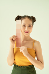 Hand of young happy female showing color palette over light background