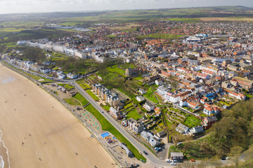Aerial photo of the British seaside town of Filey, the seaside coastal town is located in East Yorkshire in the North Sea coast showing the beach and ocean.