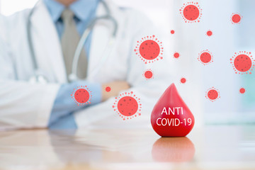 Doctor hands protracted a red blood for anti covid-19