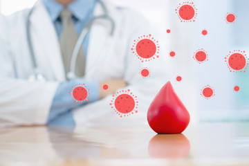 Doctor hands protracted a red blood for anti covid-19