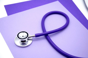 Stethoscope, stethophonendoscope, purple color, concept coronavirus Covid-19 . Measurement of...